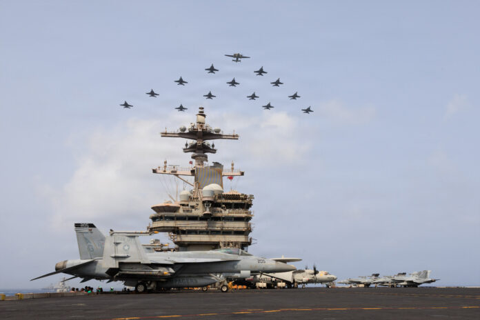 U.S. Navy Warships and Aircraft Transit Arabian Sea تحليل معمق يناقش تأثير تصاعد المواجهة بين الولايات المتحدة وإيران على مخزونات الأسلحة الأمريكية، وانعكاسات استنزاف الذخائر على الجاهزية العسكرية، وأمن الخليج، ومستقبل التوازنات العسكرية العالمية.